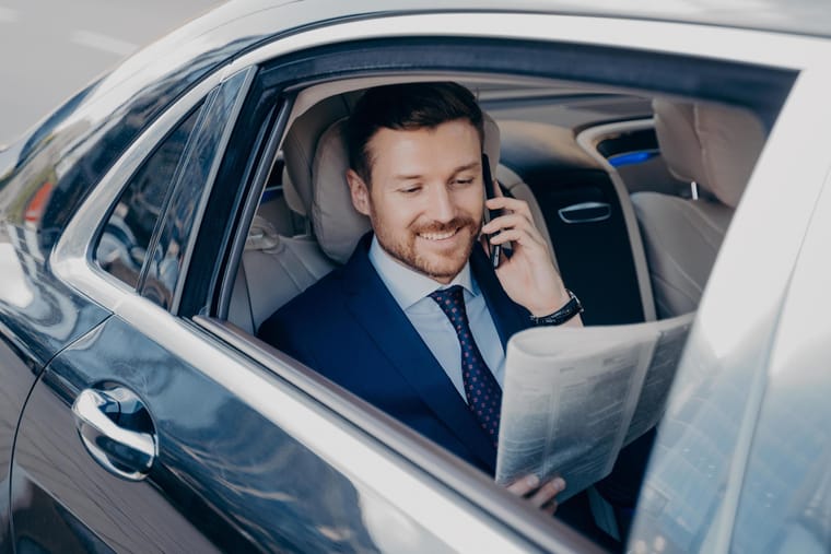 elegant-businessman-in-formal-stylish-wear-traveling-in-luxury-car-free-photo.JPG